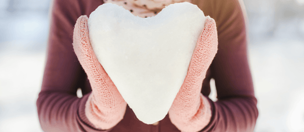 activities-make-you-love-winter-again-woman-holding-snow-heart-featured-image.png